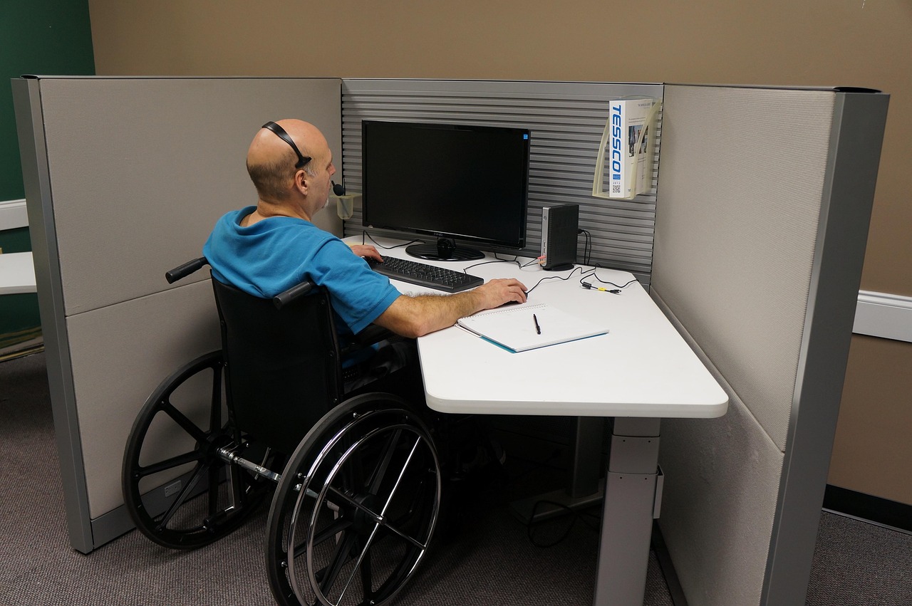 A person using assistive technology with a computer