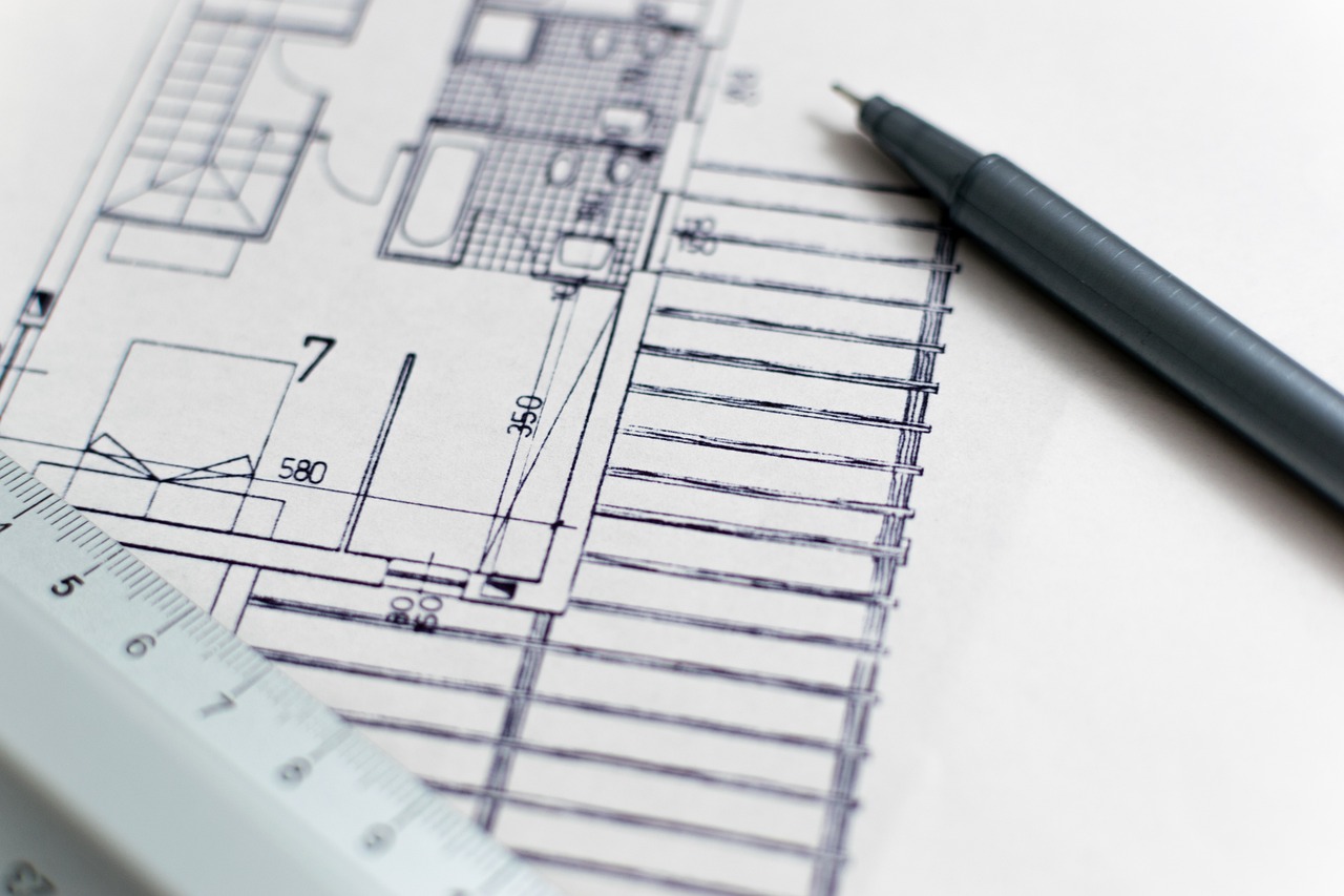 A technical blueprint diagram laid out on a desk