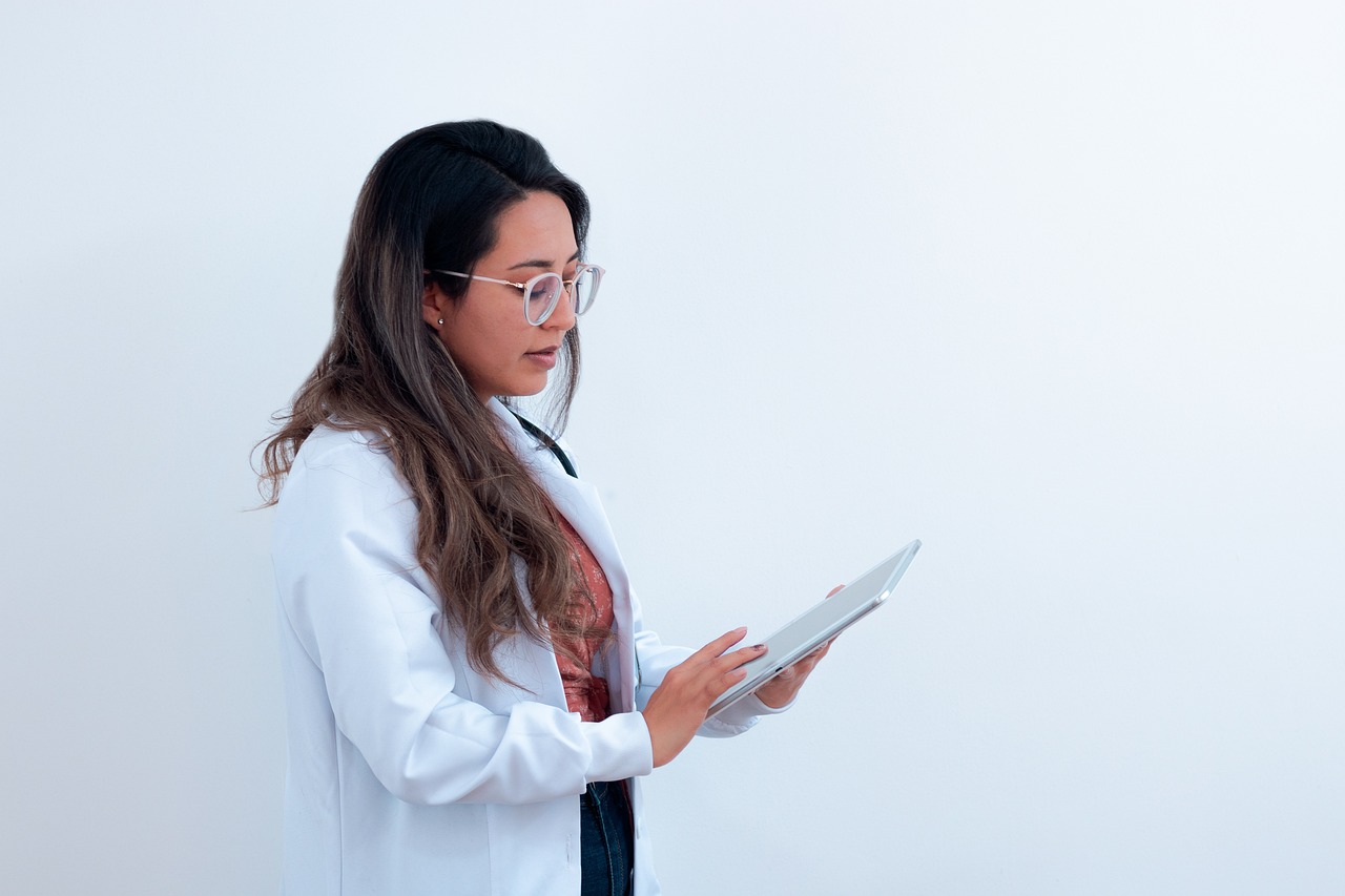 Doctor reviewing patient records on a tablet