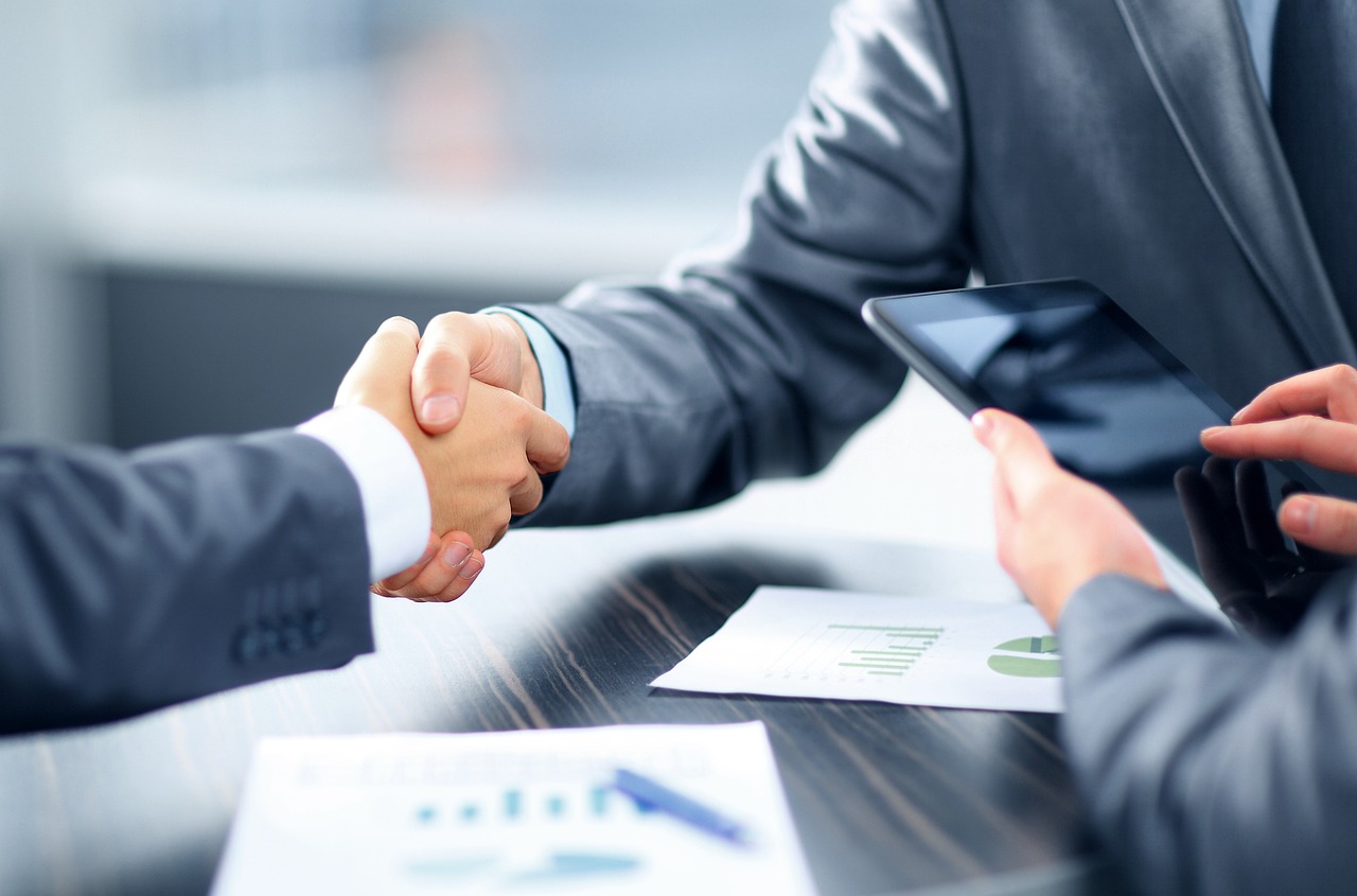 Two business partners shaking hands after a meeting