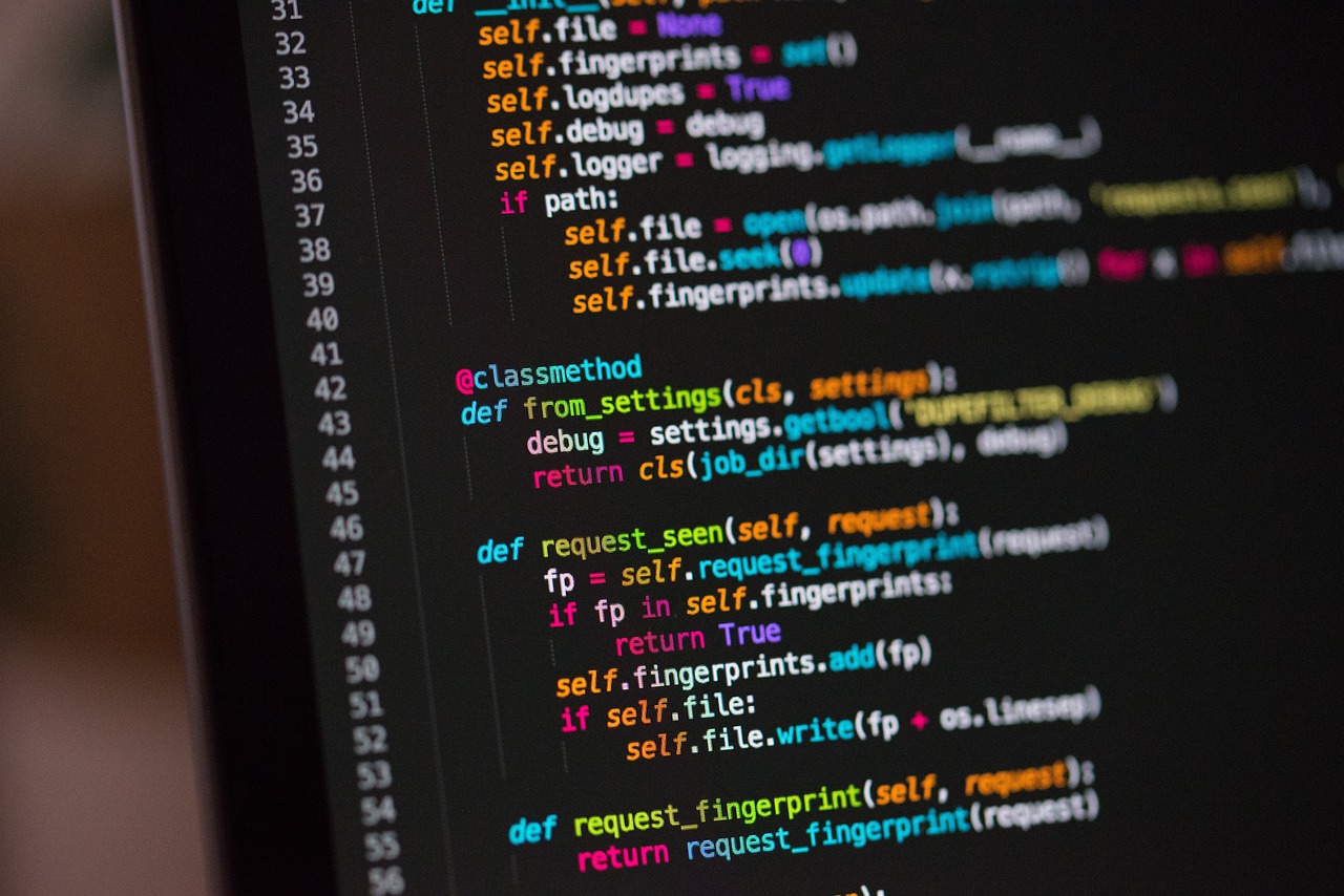 Developer debugging code on a screen at night