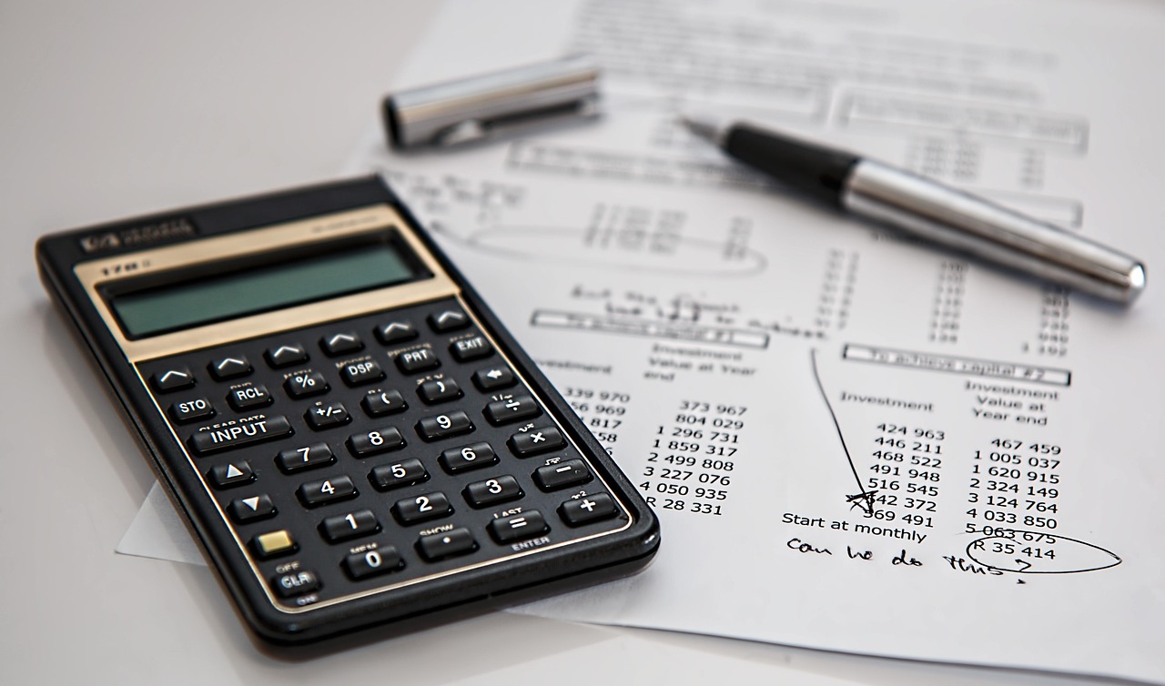 Auditor reviewing compliance documents with a checklist