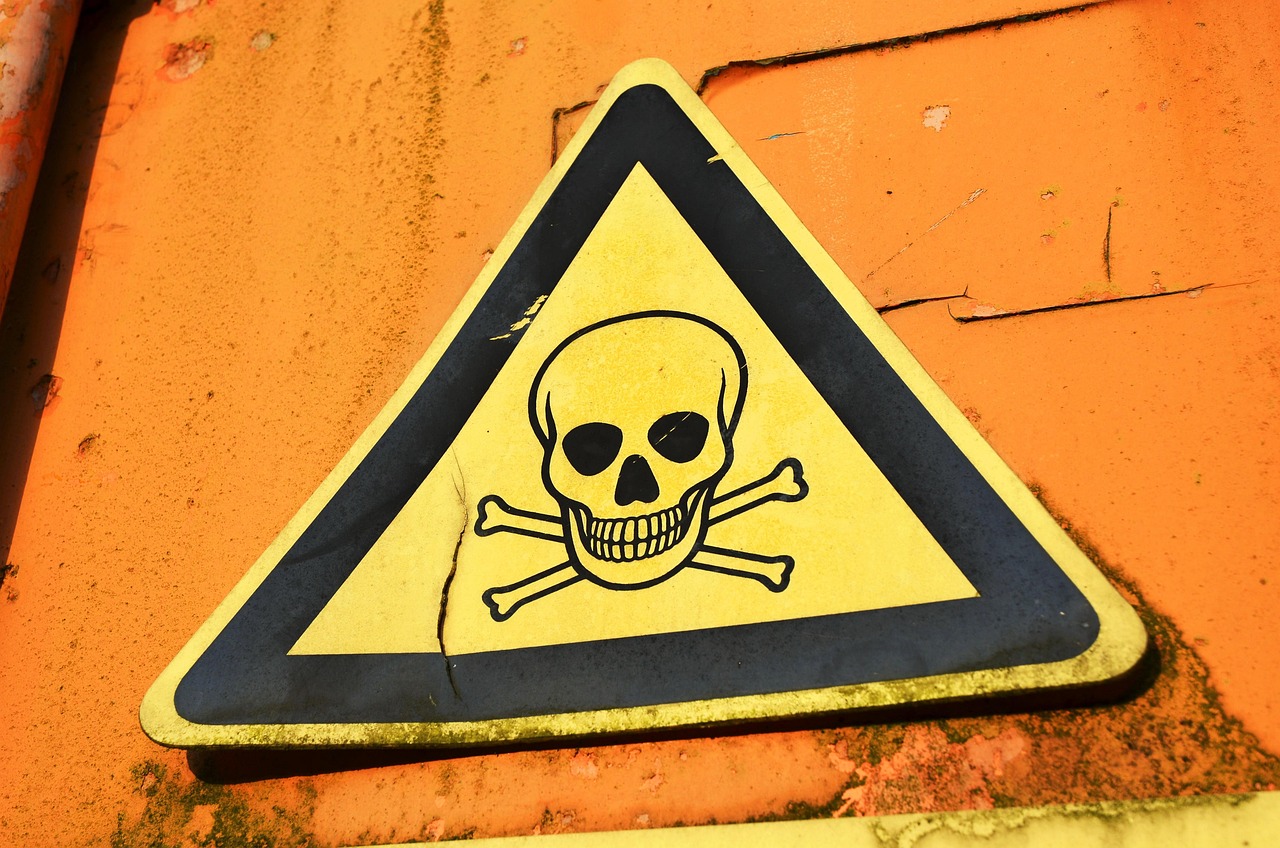 A yellow caution warning triangle sign