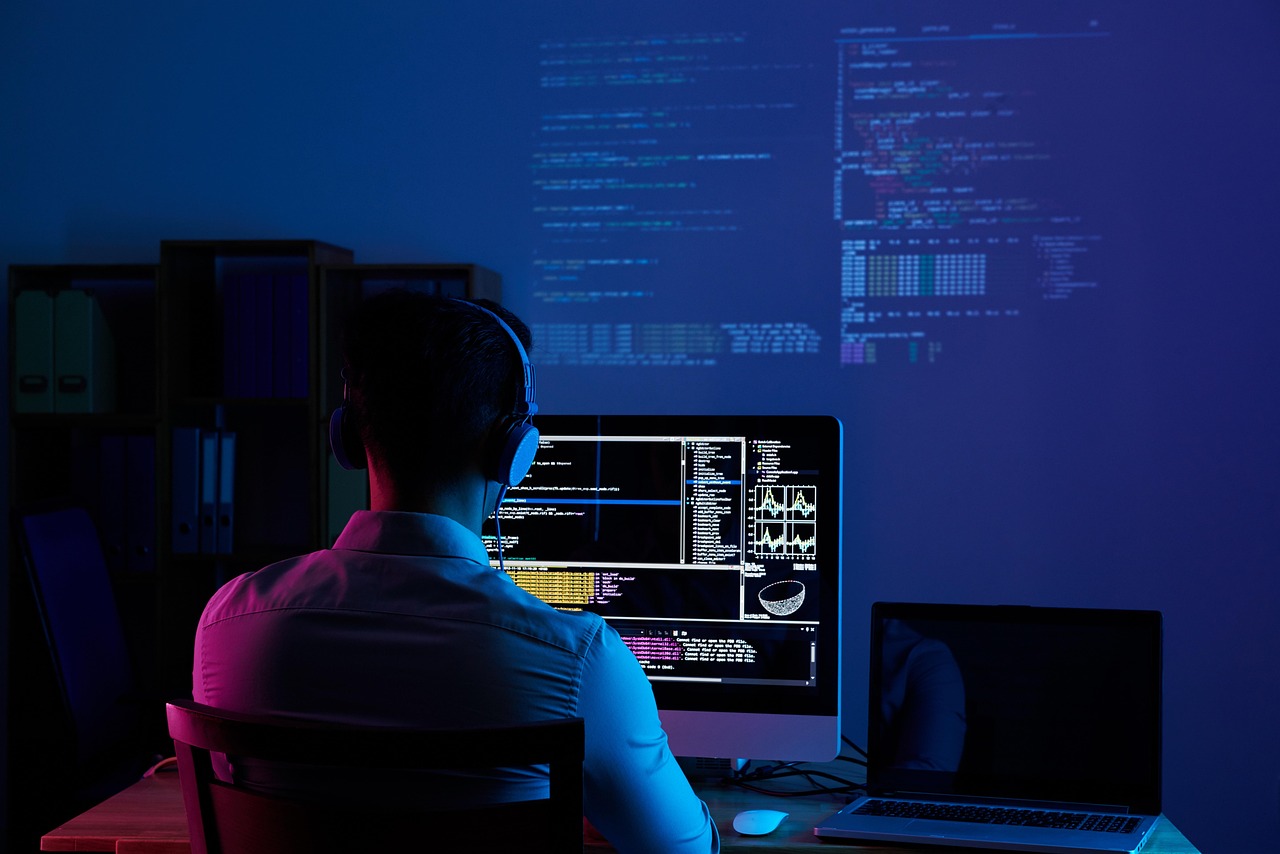 Startup team writing automated tests together at a desk