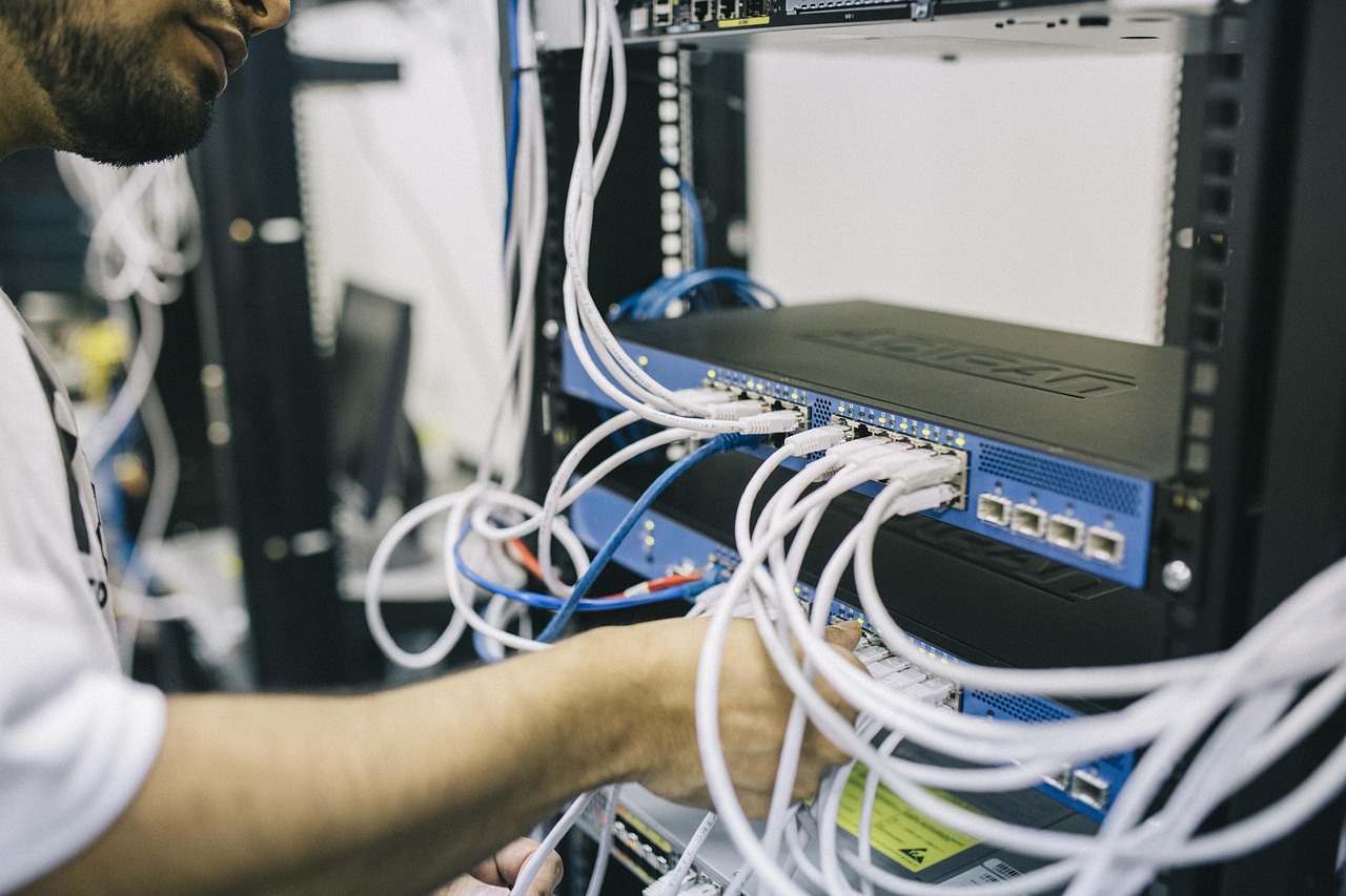 Engineer reviewing server infrastructure racks