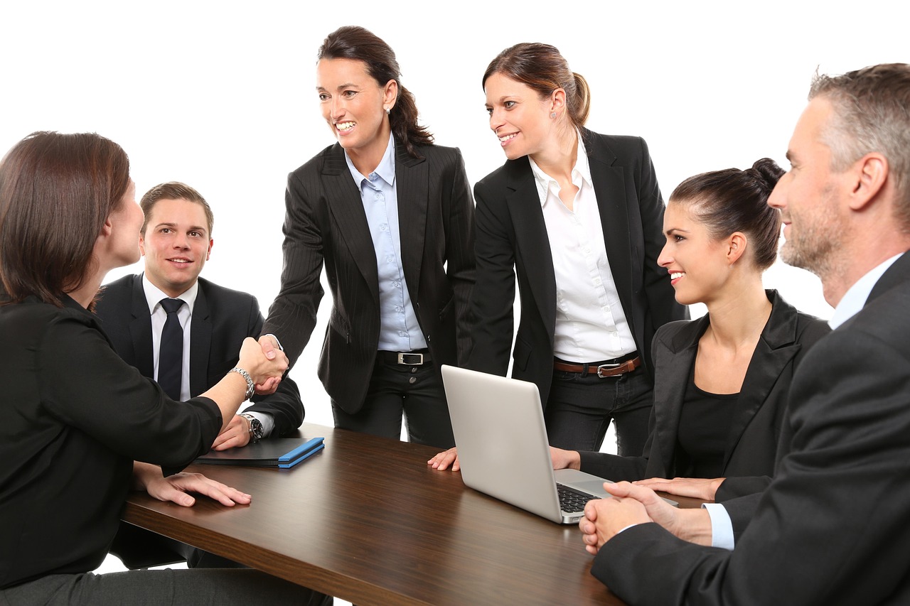 Business handshake representing user acceptance sign-off